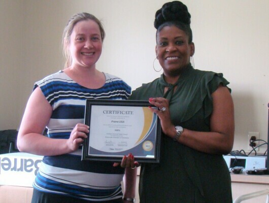 Two woman holding certificate